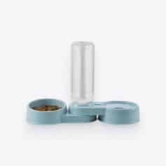 Alt text: Modern pet water dispenser with a light blue base, a water bottle, and a food bowl filled with dry kibble, ideal for pet hydration and feeding.