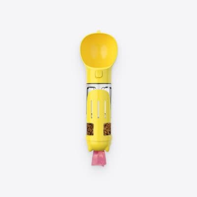 Image of a yellow pet food dispenser with a scoop, designed for easy feeding of cats and dogs, featuring snack storage compartments, ideal for pet nutrition.