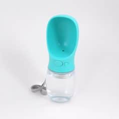 Hand sanitizer bottle with a blue silicone cover and transparent container for convenient hand disinfection. Compact design, perfect for travel and personal hygiene routines.