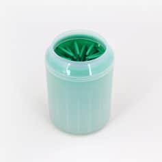 A close-up of a container holding green dental floss picks used for effective oral hygiene and dental care, available at Monalisa Store.