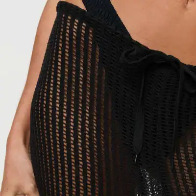High-quality black mesh dress with intricate open-knit design and adjustable lace-up detail, perfect for stylish occasions. Shop Monalisa Medical for fashionable and premium optical accessories and apparel.