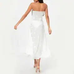 Elegant white floral dress ideal for special occasions, featuring embroidered flower details and a flowing silhouette, perfect for stylish women.