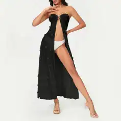 Stylish black women’s cover-up dress with floral cut-out details, perfect for beachwear or poolside fashion. Features a high slit and a chic ring detail at the top for a fashionable look.