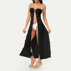 Chic black summer dress with floral appliqué, perfect for beach or casual outings, designed for women to showcase style and comfort.