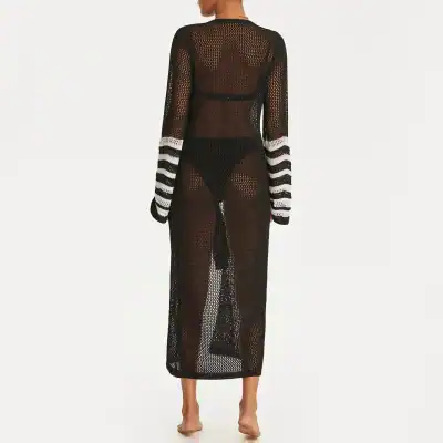 Stylish black crochet beach cover-up with white striped cuffs, perfect for swimwear and beach outings. Lightweight, breathable, and fashionable for summer vacations.