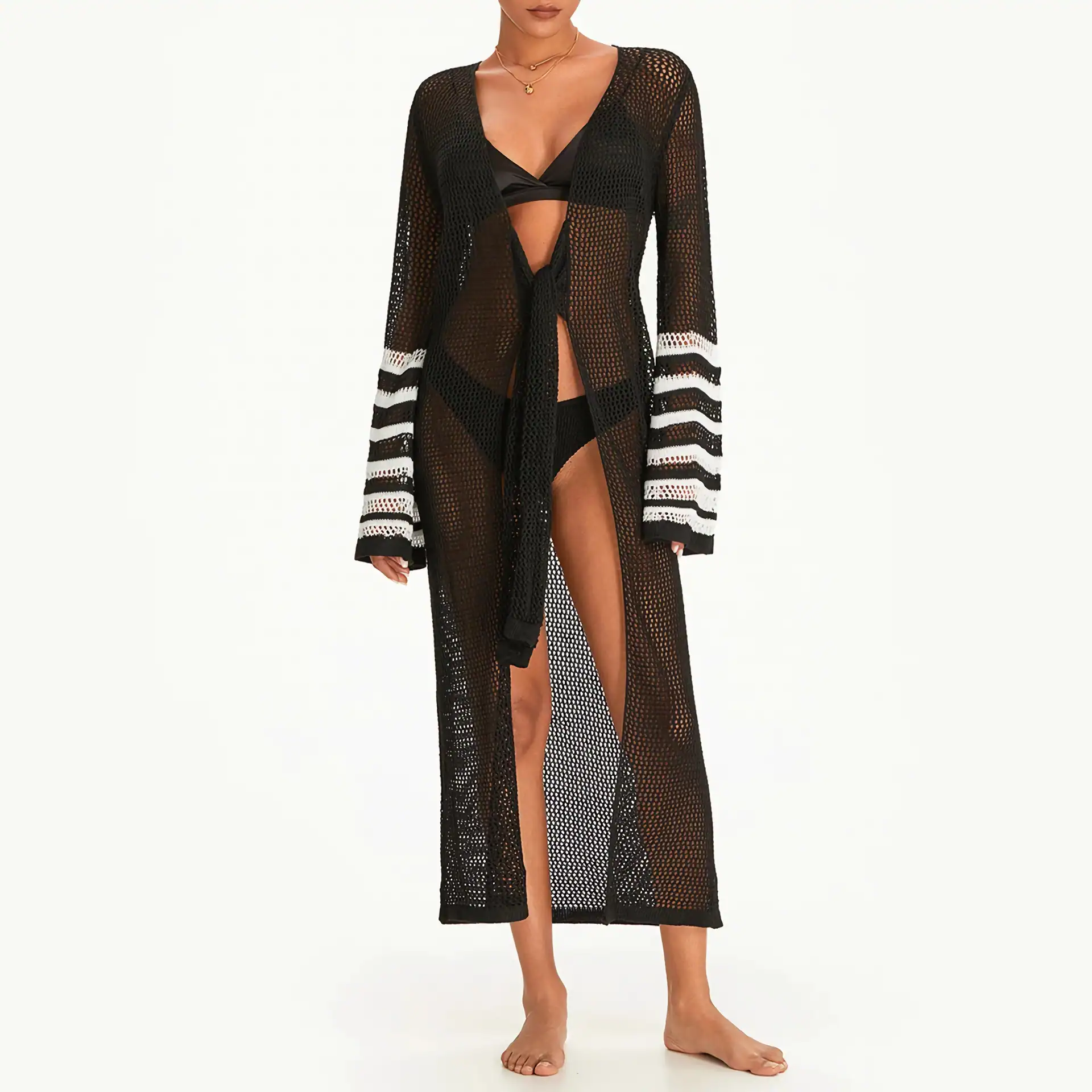 Stylish black crochet resort cover-up with white striped accents on the sleeves, perfect for beach vacations or poolside lounging. Lightweight, breathable, and fashionable for summer getaways.