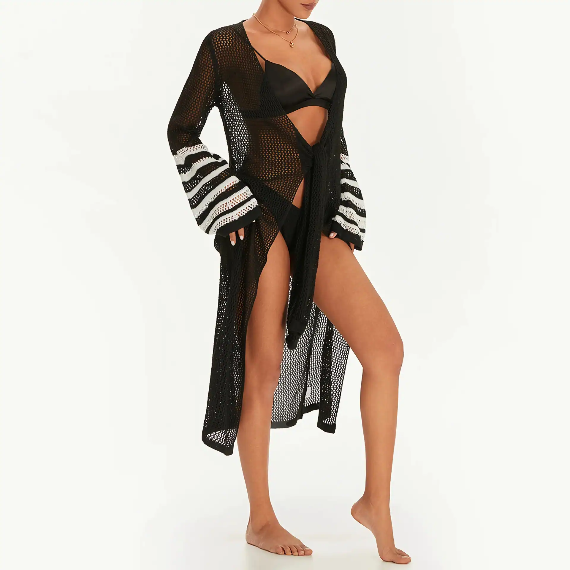 Stylish black crochet beach cover-up with striped sleeve accents, perfect for summer, poolside, or beach. Lightweight, breathable, and fashionable swimwear accessory for women.