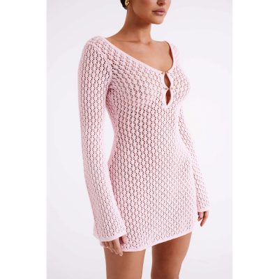 A stylish pink crochet dress with long sleeves, featuring a keyhole neckline with gold button accents, perfect for fashion-forward women seeking trendy, comfortable outerwear options.