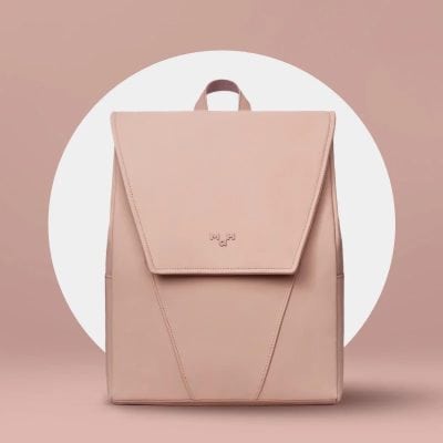 Fashionable pink backpack with sleek design, perfect for daily use and travel, featuring durable materials and functional compartments. Ideal for shopping, work, or casual outings.