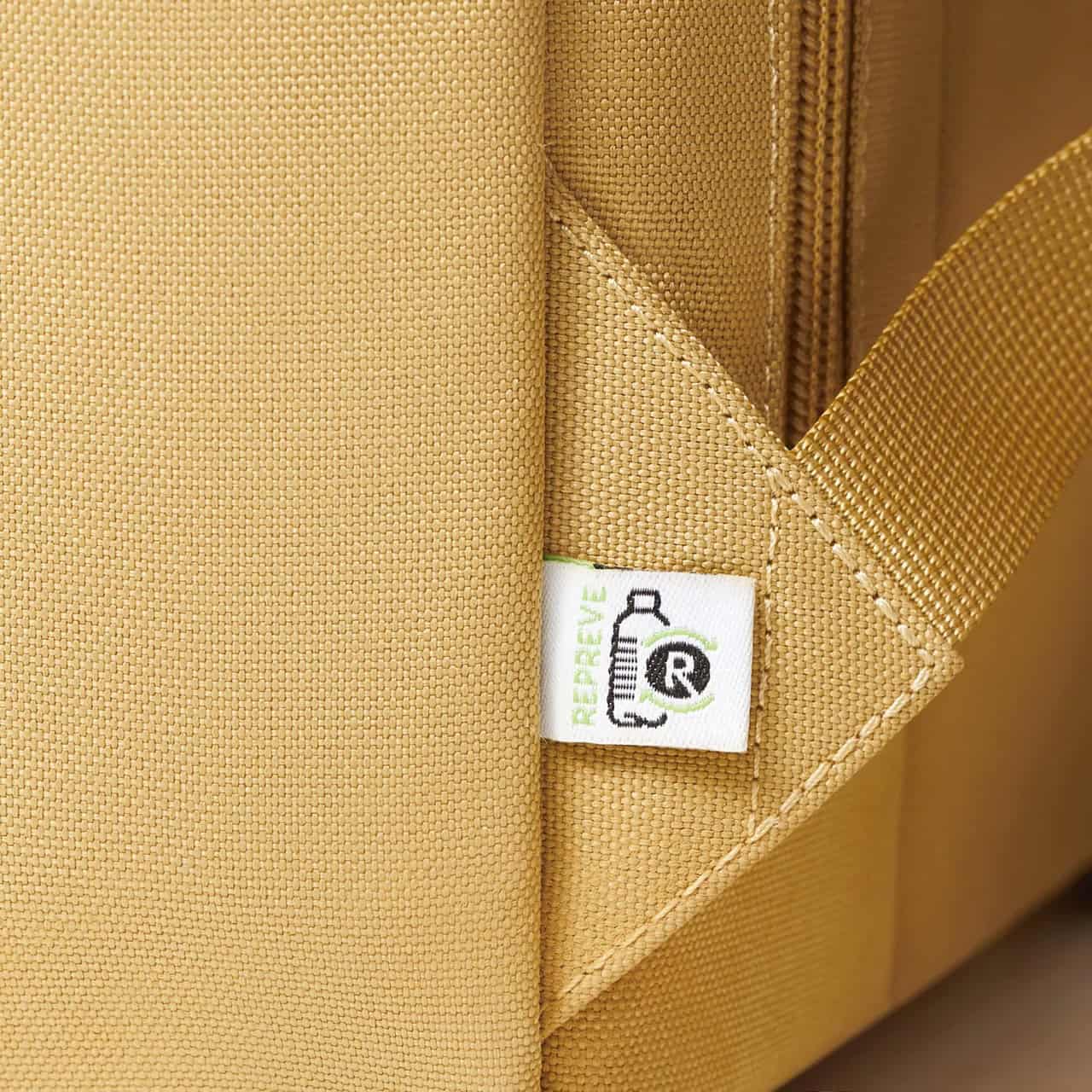 Yellow eco-friendly tote bag made of recycled fabric with sturdy strap, perfect for shopping or daily use, emphasizing sustainability and durable design.
