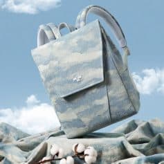Bright blue cloud pattern backpack for women, stylish and functional, ideal for everyday use and travel.
