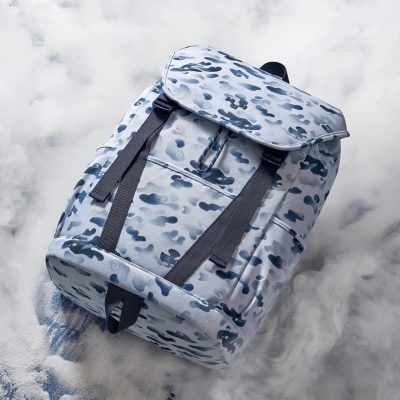 Durable camouflage backpack with multiple compartments, adjustable straps, and stylish design, perfect for travel, school, or work.