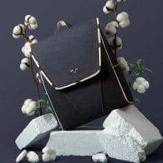 Stylish black backpack with minimalist design, perfect for daily use, travel, and school. Made from durable materials, features multiple compartments for easy organization.