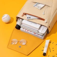 Versatile beige backpack with organized compartments for books, gadgets, and essentials, perfect for students and professionals needing a functional and fashionable bag.