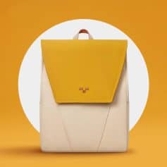 Bright yellow and cream fashion backpack for women, perfect for daily use and travel with durable design.