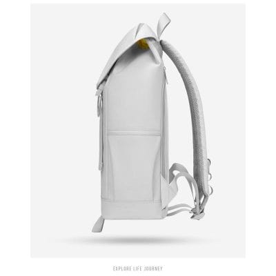 White travel backpack featuring ergonomic ventilated straps, multiple compartments, and durable material for everyday use and travel convenience.