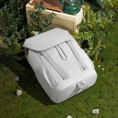 Lightweight white travel backpack with multiple compartments and adjustable straps, ideal for daily use and trips. Stylish and durable, perfect for carrying essentials on the go.