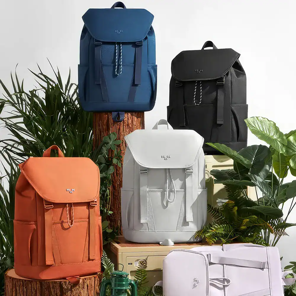 Versatile backpacks in blue, black, white, and orange showcasing stylish design, durability, and spacious compartments perfect for school, work, or outdoor adventures.