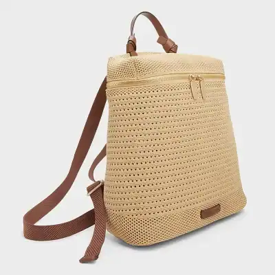 Stylish beige woven backpack with brown adjustable straps, ideal for travel and casual outings, featuring a spacious design and secure zipper closure.