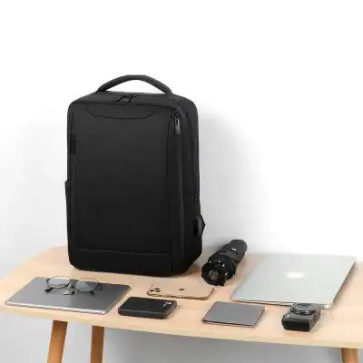 Durable black travel backpack with ergonomic design, ideal for carrying laptops, cameras, and accessories for business or leisure trips. Perfect for tech-savvy users and travelers.