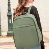 Sunlit shot of a woman carrying a sleek, eco-friendly green backpack with spacious storage, ideal for students and professionals seeking a fashionable, functional bag from Monalisa Medical.
