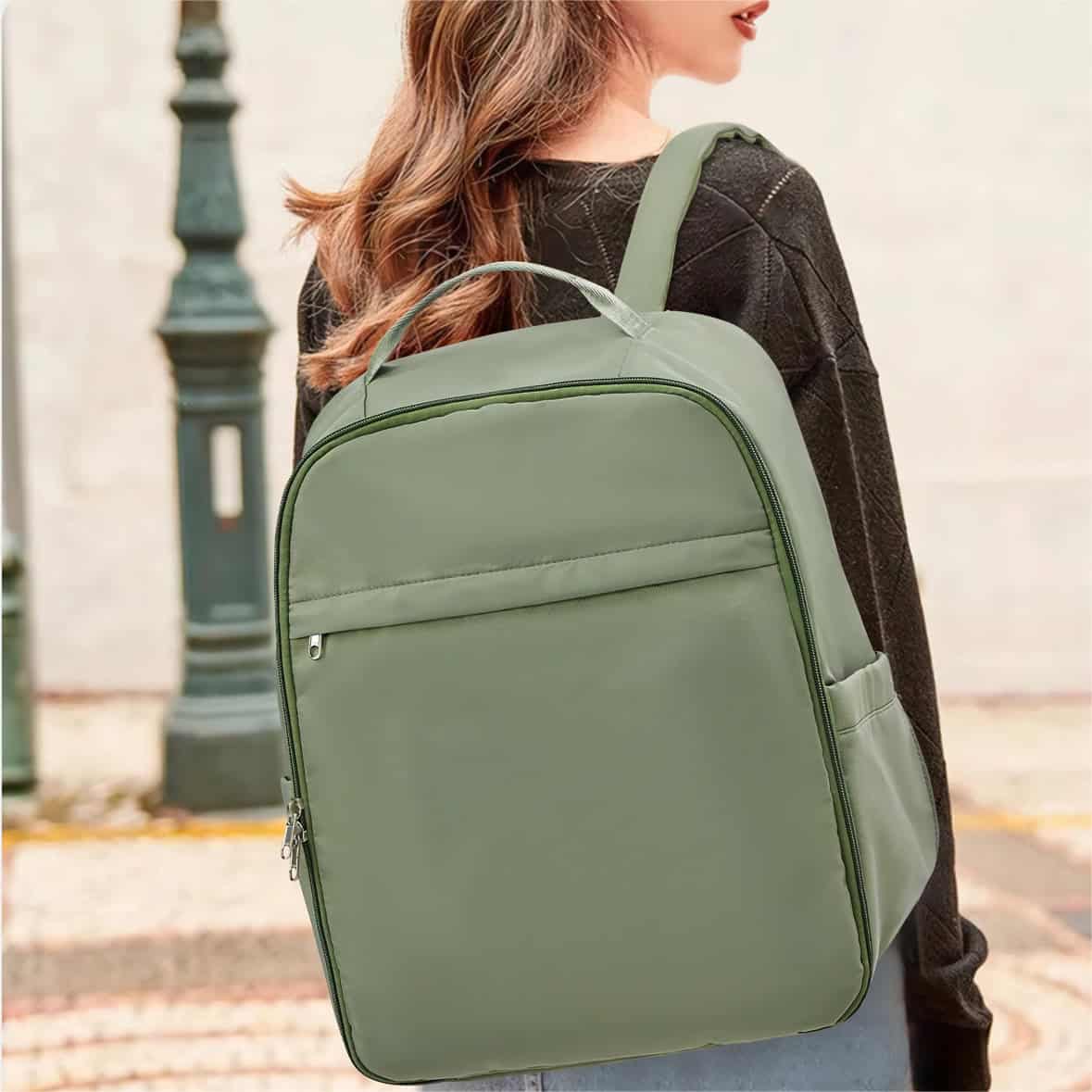 Sunlit shot of a woman carrying a sleek, eco-friendly green backpack with spacious storage, ideal for students and professionals seeking a fashionable, functional bag from Monalisa Medical.