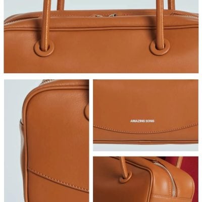 High-quality brown leather handbag with sturdy handles and zipper closure, perfect for stylish everyday use and travel.
