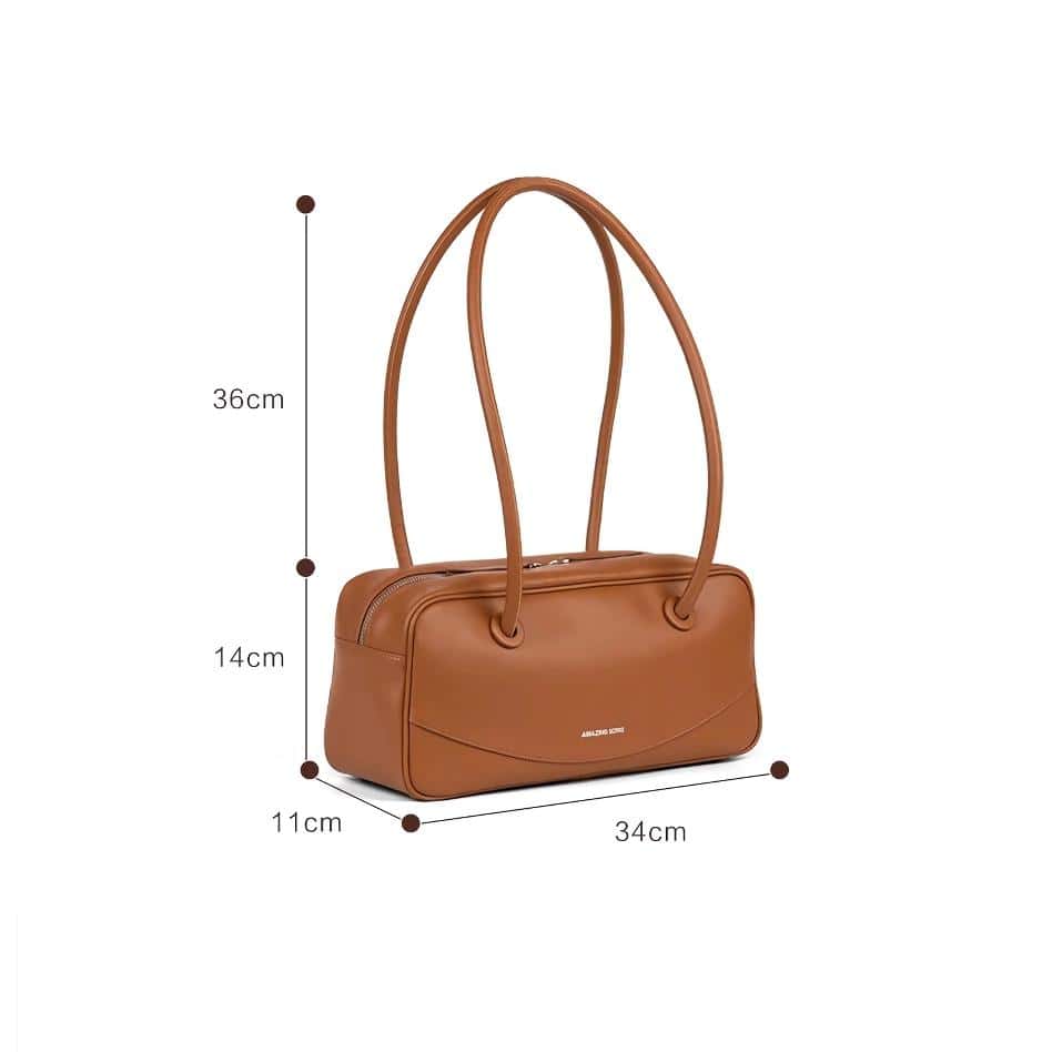 Stylish brown handbag with adjustable straps, perfect for fashion-forward women. Made from high-quality material, suitable for daily use and shopping.