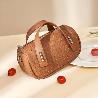 Stylish tan leather handbag with woven design, perfect for fashion-forward individuals seeking high-quality accessories. Shop premium handbags at Monalisa Medical for timeless style and durability.