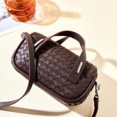 High-quality woven leather handbag perfect for stylish accessories, suitable for everyday use. Features adjustable strap and modern design, ideal for fashion-forward individuals.