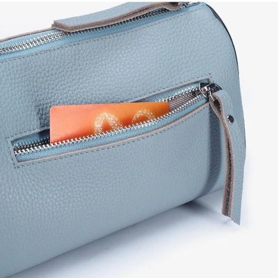 Blue leather bag with secure zip pocket, perfect for storing cards and essentials. Ideal for fashion-forward individuals seeking practicality and style in one accessory.