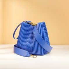 Luxurious blue handbag with ribbed design and gold hardware, perfect for stylish outings and accessories. Ideal for fashion-conscious individuals seeking trendy, high-quality bags.