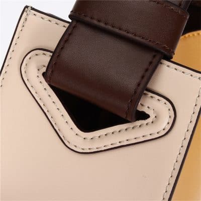 Close-up of a fashionable handbag strap with premium stitching and leather design, ideal for fashion accessories, luxury bags, and accessory shopping.