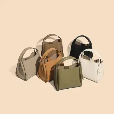 Stylish beige, tan, black, white, and olive green leather handbags perfect for daily use and fashion accessories.