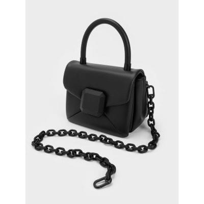 A stylish black handbag featuring a unique chain strap and modern design, perfect for fashion-forward individuals seeking a trendy accessory.