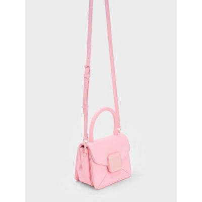 Pink designer crossbody bag for women, stylish accessory for daily use, featuring adjustable strap and modern design, perfect for casual and party wear.