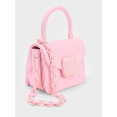 Stylish pink handbag featuring a chunky chain strap and unique hexagonal clasp, perfect for fashion-forward looks and accessories.