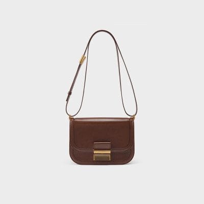 High-quality brown leather shoulder bag with adjustable strap and gold accents, perfect for stylish everyday wear and essential organization.