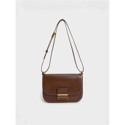 Elegant leather women's shoulder bag with a sleek design, adjustable strap, and spacious interior, perfect for everyday use and trendy fashion statements.