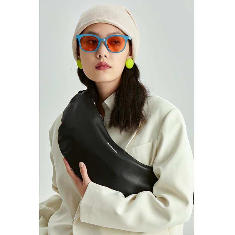 Stylish orange and blue sunglasses with UV protection, perfect for fashion-forward individuals.