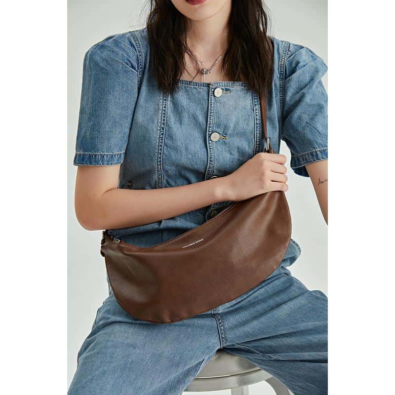 Stylish brown leather crossbody bag for women, perfect for everyday use and travel. Durable, lightweight, and versatile accessory to elevate your fashion statement.