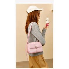 Young woman in casual outfit with handbag enjoying ice cream at Monalisa Medical store, emphasizing stylish accessories and trendy fashion shopping experience.