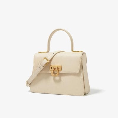 Luxury designer handbag with gold accents, perfect for fashion-forward accessories.