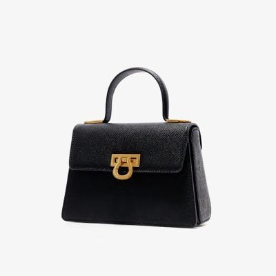 Luxurious black leather designer handbag with gold hardware, perfect for fashion-forward women seeking premium quality accessories.