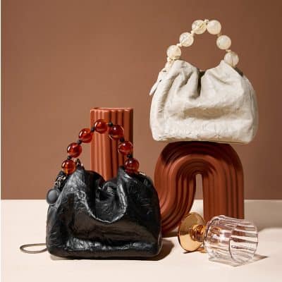 Stylish designer handbags featuring statement beaded handles, perfect for fashion-forward accessories and premium handbags from Monalisa Store.