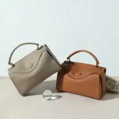 Stylish leather handbags with top handles, perfect for fashion-forward women and all occasions. Crafted from premium materials for durability and sophistication.