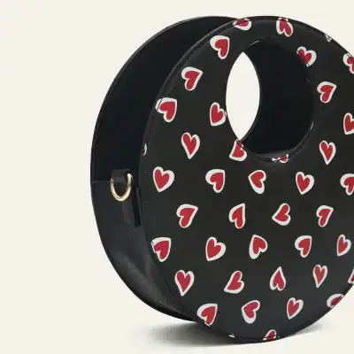 Stylish black sunglasses case with red and white heart pattern, perfect for protecting your sunglasses in fashion-forward style, available at Monalisa Store.