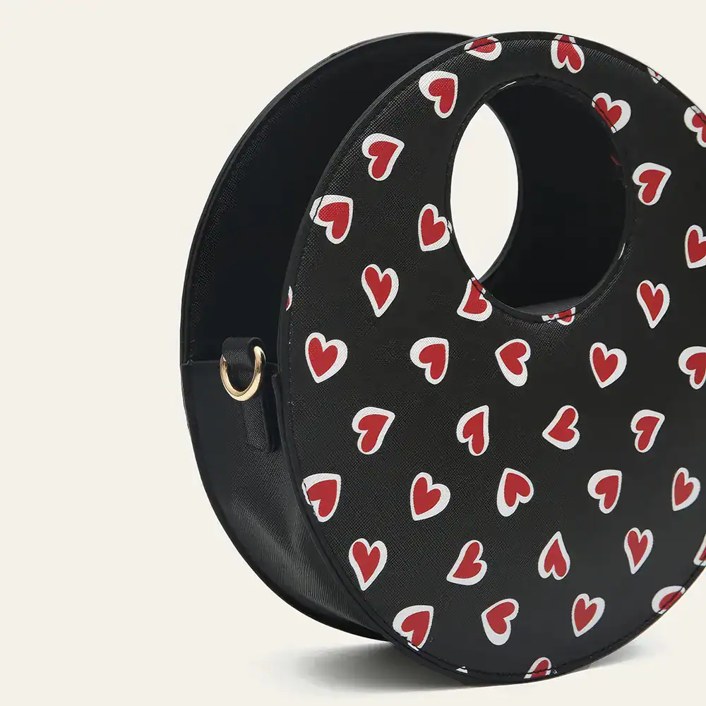 Stylish black sunglasses case with red and white heart pattern, perfect for protecting your sunglasses in fashion-forward style, available at Monalisa Store.