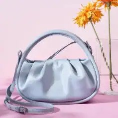 A stylish silver handbag featuring a sleek design, perfect for accessory enhancement. Crafted from high-quality material, ideal for daily use or special occasions, featuring adjustable strap for convenience.