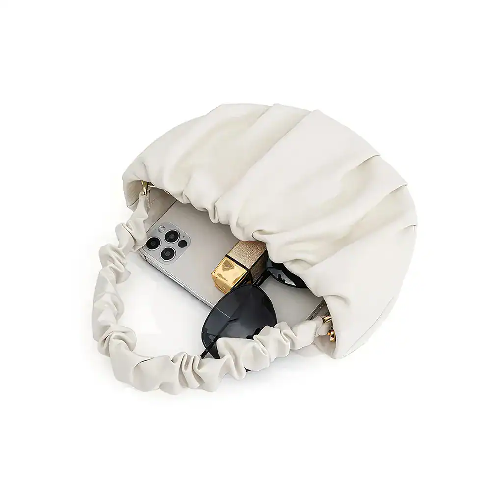 Elegant white clutch bag with interior space for phone, sunglasses, and makeup essentials, ideal for stylish events and daily use.